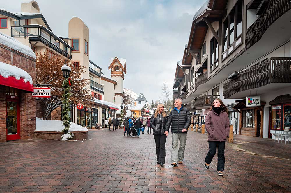 Family in Vail Village in the winter. Apres Ski